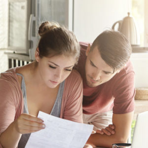 young couple reviewing bills