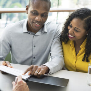 couple examines financial documents