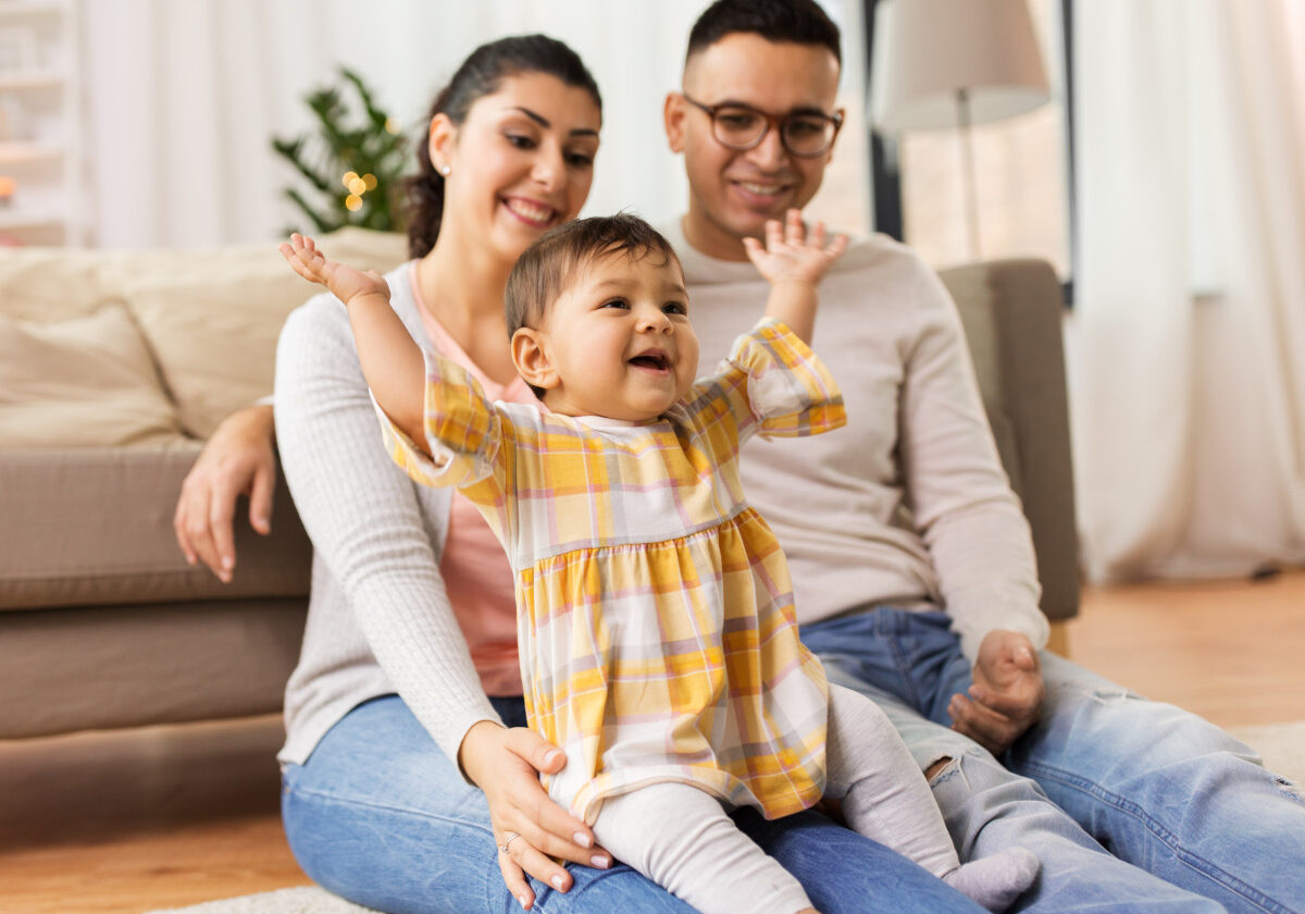 Happy family at home with baby